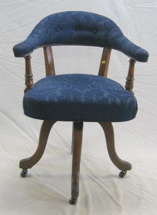 A Victorian oak tub back revolving office chair
