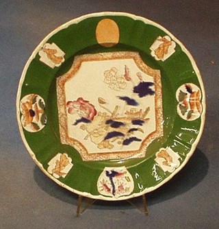 A Victorian Real Ironstone China green Oriental style plate, the base marked Real Ironstone China and impressed 10"