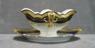 A 19th/20th Century "Sevres" porcelain twin spouted sauce boat with blue and gilt banding