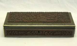 A carved Eastern glove box with hinged lid 11"