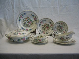 A 45 piece Royal Doulton Old Leaf Spray pattern dinner service comprising 18" meat plate, 15" meat plate (f), 11" meat plate, 2 vegetable tureens and covers (1 crazed), 2 sauce tureens and covers with ladles (1 cracked and crazed, 1 ladle f) 13 10" plates (2 cracked and 1 with slight chip to side) 11 10" side plates (7 cracked), 12   8 1/2" tea plates (8 cracked), 2 7" sauce tureen stands (cracked)