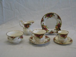 A 32 piece Royal Albert Old Country Rose pattern tea service comprising twin handled bread plate, cream jug, 6 - 6 1/2" tea plates, 6 cups and 6 saucers, sugar bowl, 6 coffee cans (1 cracked) and 5 saucers 