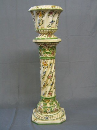 A Capo di Monte floral decorated pottery jardiniere and stand (f and r)
