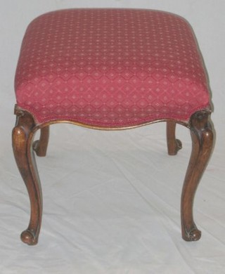A Victorian mahogany serpentine shaped stool, on cabriole supports 19"