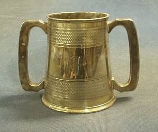 A silver plated twin handled pint tankard by Elkingtons 5"