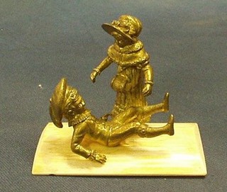 A fine quality 19th Century gilt bronze and ivory figure of 2 children sliding on ice, 4"