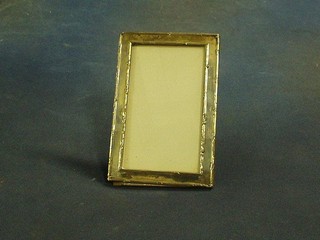 A silver easel photograph frame 6" x 4" marks rubbed