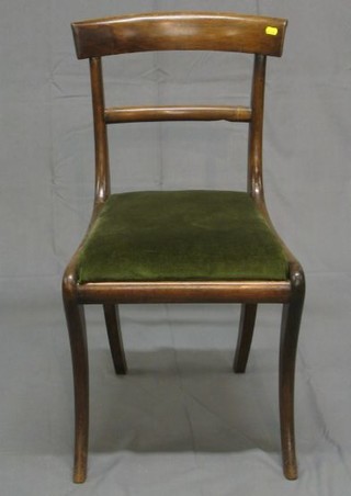 A set of 4 Georgian mahogany bar back dining chairs with plain mid rails on sabre supports (old worm marks to frame)