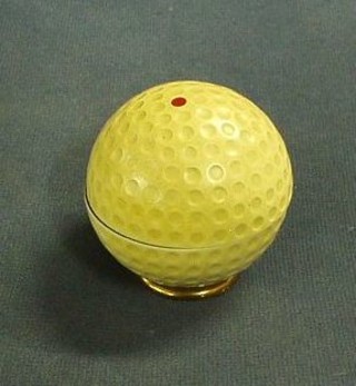 A German table lighter in the form of a golf ball