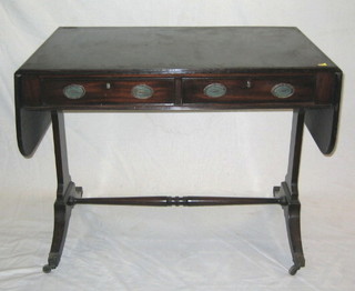 A 19th/20th Century Georgian style sofa table, raised on standard end supports with turned stretcher ending in brass caps and castors 37"