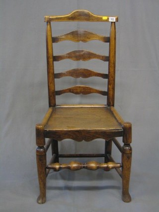An 18th/19th Century elm ladder back chair with solid seat, raised on club supports