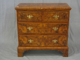 A Queen Anne style figure walnutwood chest of 2 short and 2 long drawers, raised on bracket feet 36"