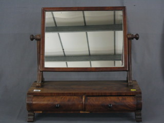 A Victorian rectangular plate dressing table mirror contained in a mahogany swing frame, the base fitted 2 drawers 22"