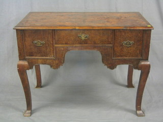 A Georgian figured exotic timber desk/low boy fitted 1 long drawer flanked by a pair of drawers raised on cabriole supports 42"