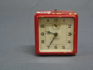 An Art Deco alarm clock with square painted dial and Roman numerals, "The Eye Opener" by Ingersoll