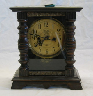 A 19th Century Continental 8 day striking shelf clock with paper dial and Arabic numerals contained in a walnutwood finished case
