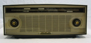 A BC402 radio contained in a brown and yellow plastic case