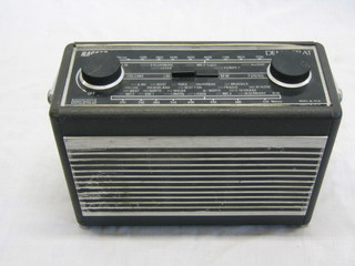 A Hacker Democrat portable radio in a black fibre case