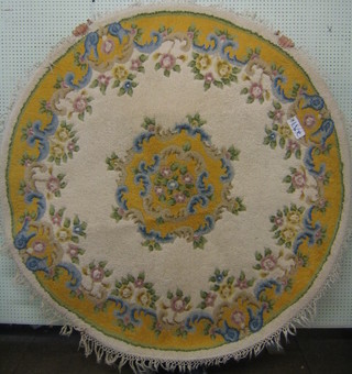 A circular white and floral ground Indian rug 67"