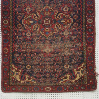 A 19th/20th Century Caucasian rug with central medallion within multi row borders 54" x 36"