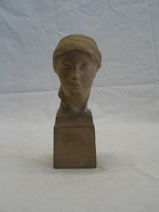 A terracotta head and shoulders portrait bust of a classical lady, raised on a square base, the interior marked Frederick Lessore 10"