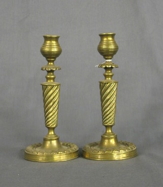 A pair of 19th Century brass candlesticks with swirled columns and pierced cast bases (no sconces) 8"
