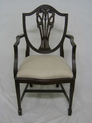 A set of 6 Hepplewhite style mahogany shield back dining chairs with Prince of Wales feather decoration (2 carvers, 4 standard)