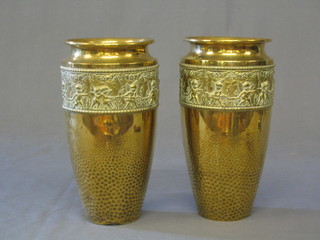A pair of embossed and planished copper vases 11"