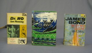 A 1962 paperback edition of Ian Fleming's "James Bond The Spy Who Loved Me", a 1964 14th edition of "Dr No", a 1972 17th edition of J R Tolken's "The Hobbit" and a leather bound address book