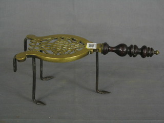 A 19th Century pierced brass range trivet