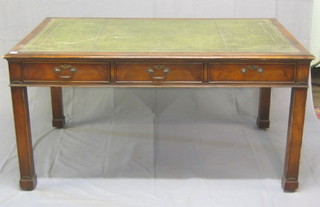 A Georgian style mahogany library table with inset tooled leather writing surface, above 6 long drawers, raised on square tapering supports, 60"