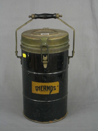 A circular metal Thermos flask