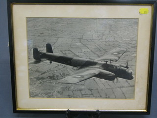 A black and white photograph of an RAF Armstrong-Whitworth Whitley in flight 9" x 12"