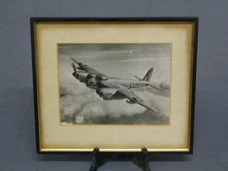 A black and white photograph of an RAF De-Havilland Mosquito in flight 6" x 8"