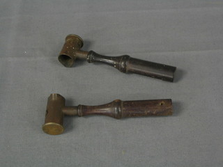 A pair of 19th Century brass powder measures with turned wooden handles