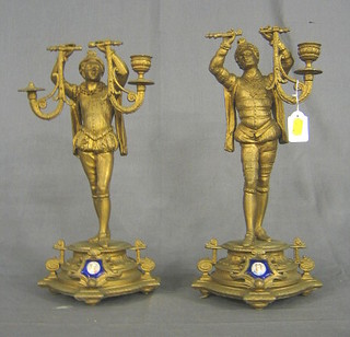 A pair of 19th Century gilt painted spelter candlesticks supported by figures 15"