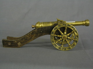 A reproduction Continental brass canon/wooden trunion