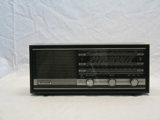 A 1950/60's Grundig model 110A (GB) radio contained in a grey plastic case