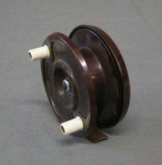 A brown Bakelite centre pin fishing reel by M Lee & Sons