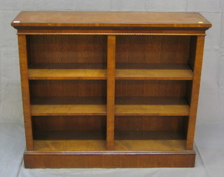 A Georgian style mahogany bookcase fitted adjustable shelves, raised on a platform base, 45"
