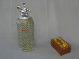 A wooden folding cribbage board and a soda siphon