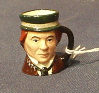 A Royal Doulton tiny character jug "David Copperfield" D6680 (slight chip to base)