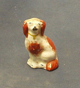 A 19th Century Staffordshire figure of a seated spaniel 4"