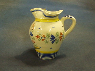 A Quimper jug with pinched spout decorated a standing lady 8"