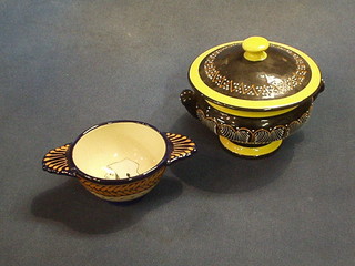 A Quimper Broderie twin handled quaiche, the base marked HB Quimper 84 and a circular lidded jar and cover 5", the base marked Quimper PF 487 D306