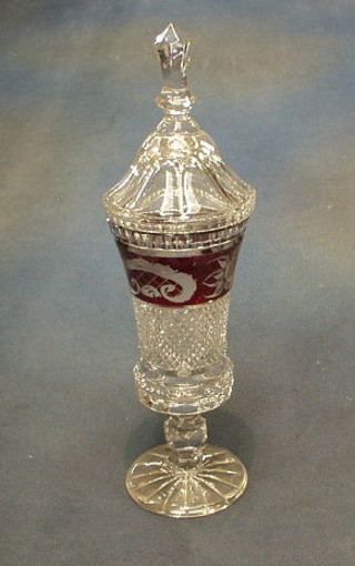 A 19th Century Bohemian cut glass urn and cover with red overlay decoration 12"