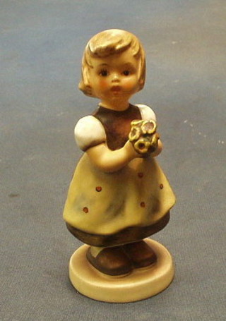 A Hummel figure of a girl with posy of flowers, the base marked 1963 5"
