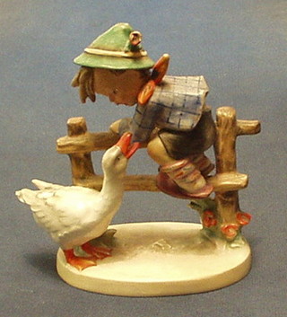 A Goebal figure of a boy climbing a fence with goose, the base marked 1948 195/1 (f and r)