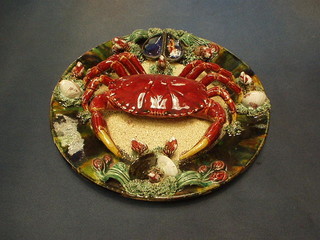 A Portuguese pottery plate decorated a crab 12", the reverse incised