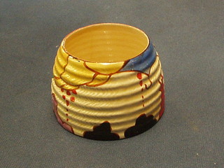 A circular Clarice Cliff Fantasque patterned preserve jar